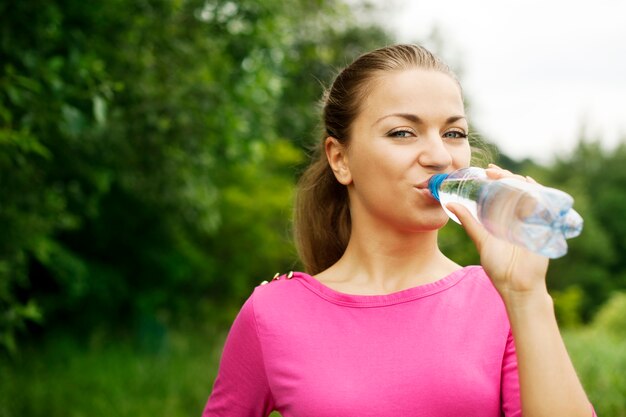 Young woman drinking water