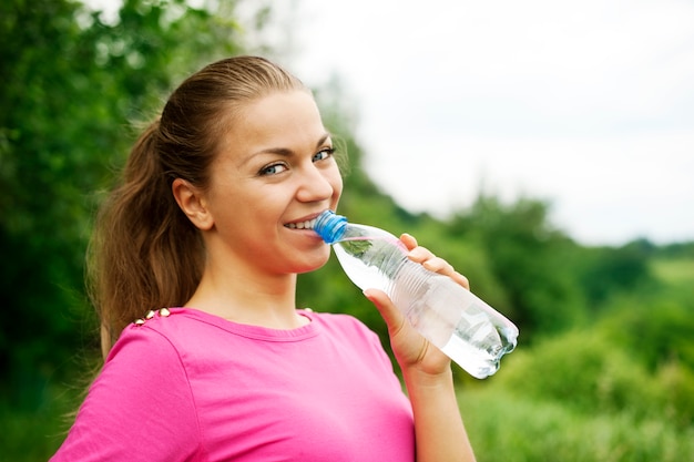 Young woman drinking water