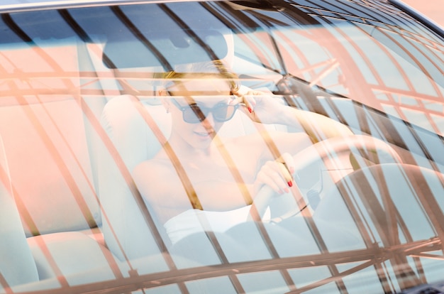 Young woman driving a car