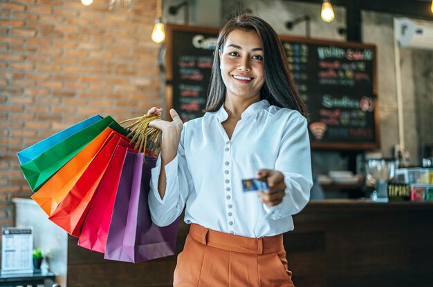 Young woman enjoy shopping with credit cards.