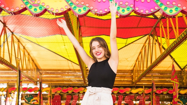 Young woman enjoying at amusement park