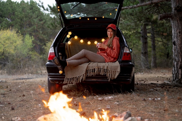 Young woman enjoying bonfire