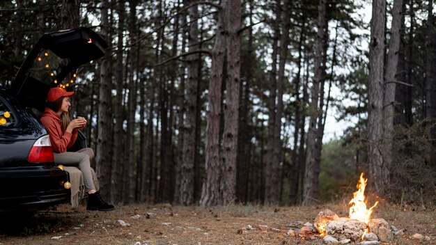 Young woman enjoying bonfire