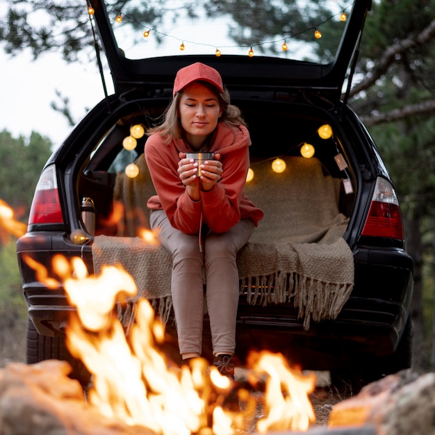 Young woman enjoying bonfire