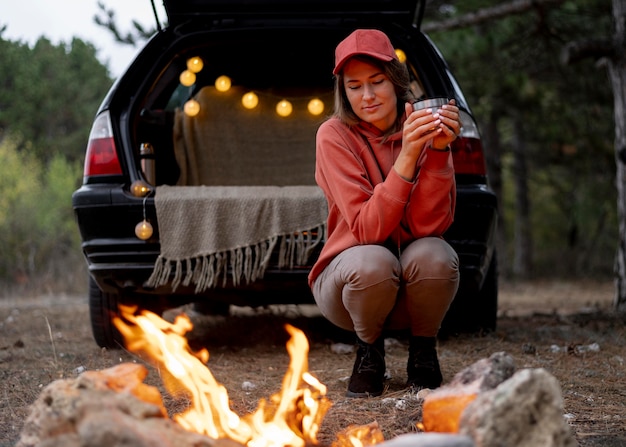 Young woman enjoying bonfire