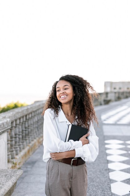 Young woman enjoying a book outside