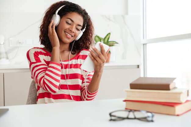 Young woman enjoying listen music on headphones