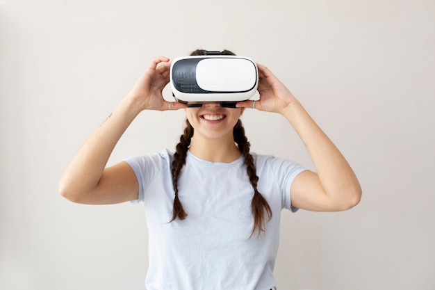 Young woman enjoying new technology vr glasses