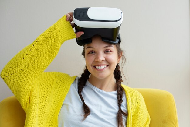 Young woman enjoying new technology vr glasses