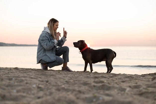 Young woman enjoying some time with her dog