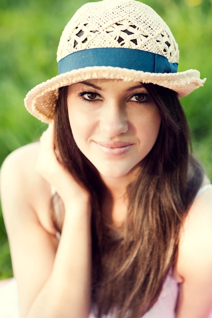 young woman enjoying the summer in a park