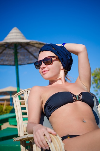 Young woman enjoying sun at the beach