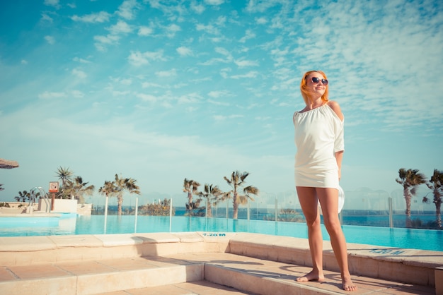 Free photo young woman enjoying sun