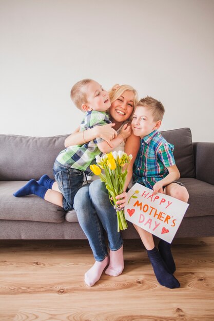 Young woman enjoying with her children