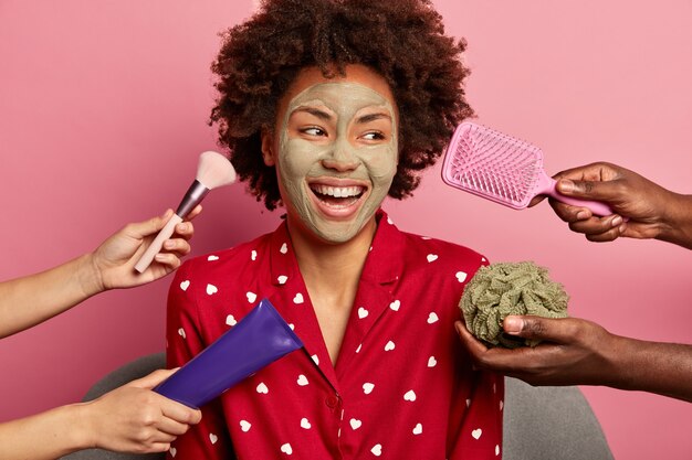 Young woman enjoys beauty spa at home siting in bathrobe