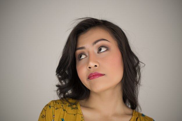 Young woman envy on  white background