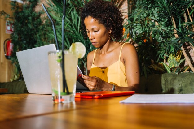 Young woman examining the document in the restaurant