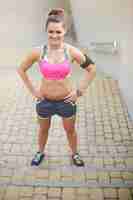 Free photo young woman exercising outdoor. woman ready to start her everyday training