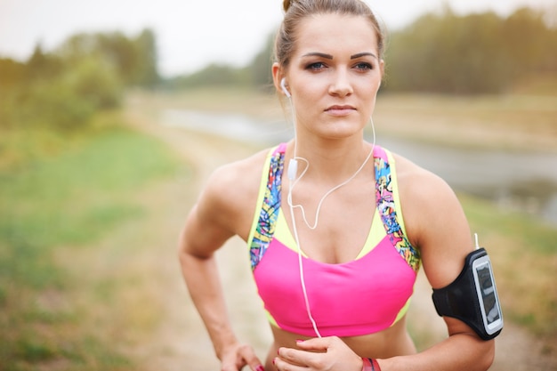 Young woman exercising outside. Attractive woman jogging in the park