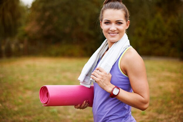 Young woman exercising outside. Motivation is the key to success