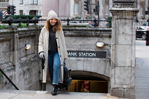 Young woman exiting the subway in the city