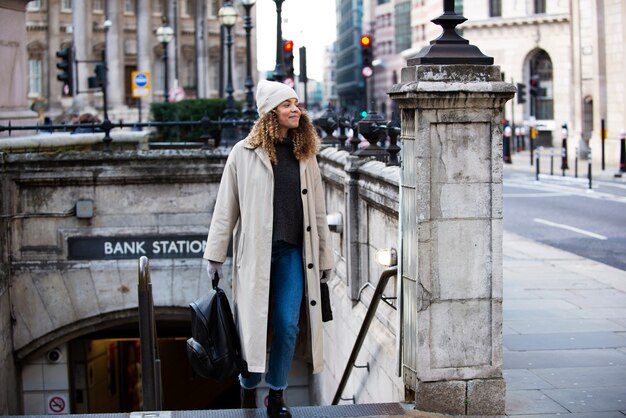 Young woman exiting the subway in the city