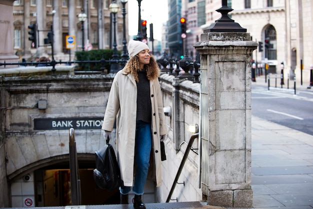 Young woman exiting the subway in the city