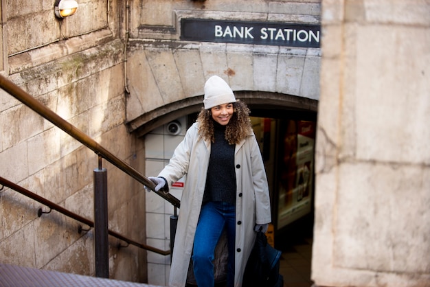 Young woman exiting the subway in the city