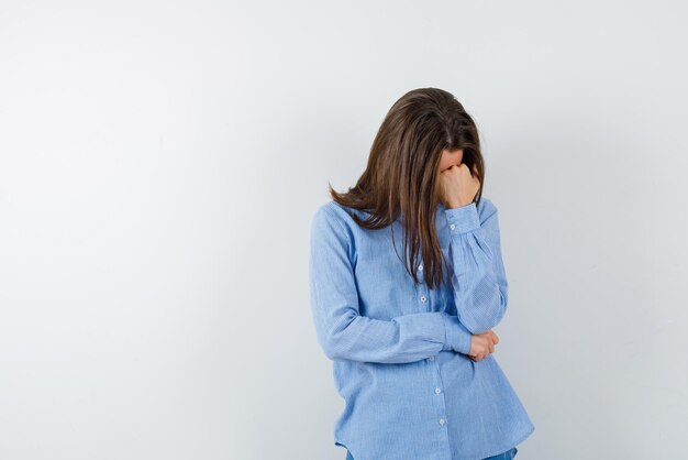 Young woman feeling tired on white background