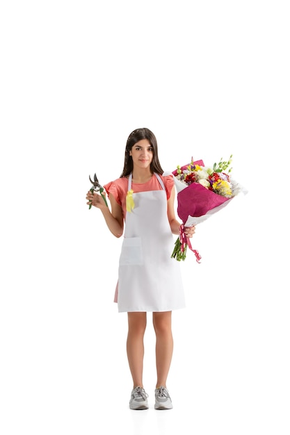 Young woman, florist with bouquet isolated on white studio