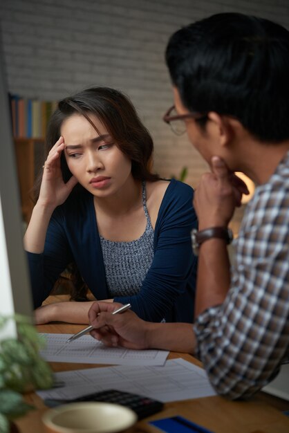 Young woman frustrated by bankrupcy news from her husband