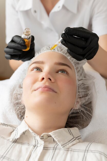 Young woman getting an eyebrow treatment at the beauty salon