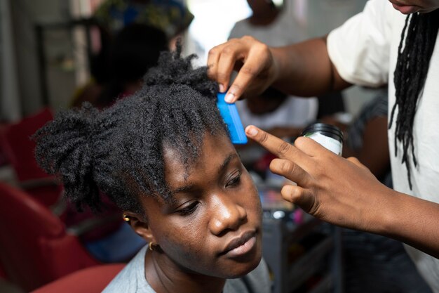 Young woman getting her hair done at the beauty salon