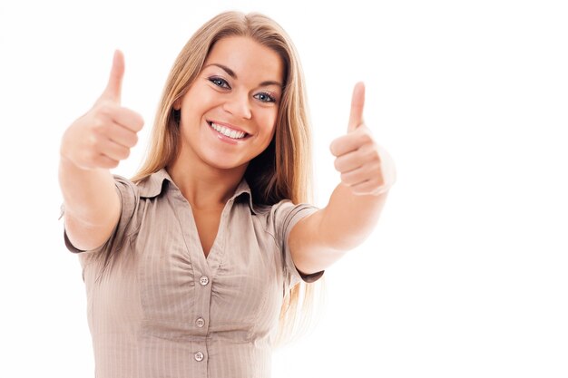 Young woman giving thumbs up