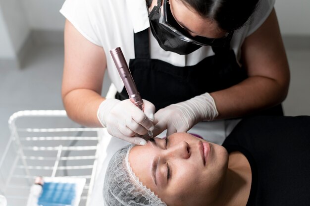 Young woman going through a microblading treatment