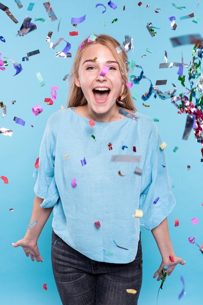Young woman happy at confetti time