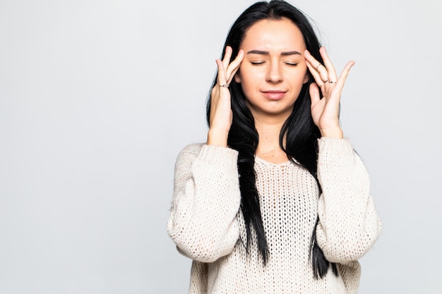 Free photo young woman has headache isolated on gray wall