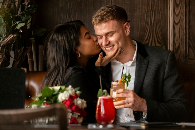 Free photo young woman having a bouquet of roses from her boyfriend