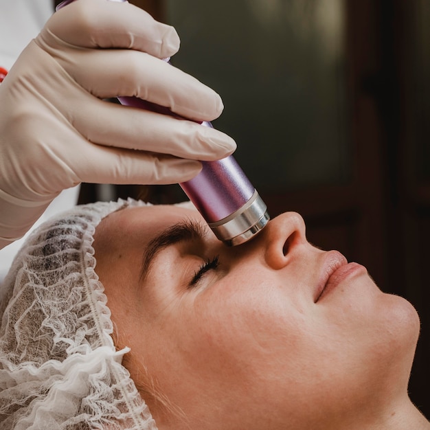 Young woman having a cosmetic treatment at the wellness center