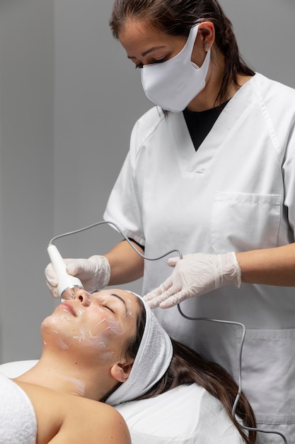 Young woman having a facial treatment