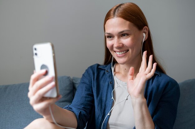 Young woman having a family videocall