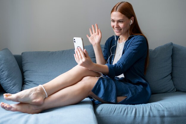 Young woman having a family videocall