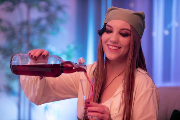 Young woman having fun at costumes party