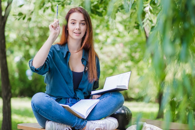 Young woman having idea while studying