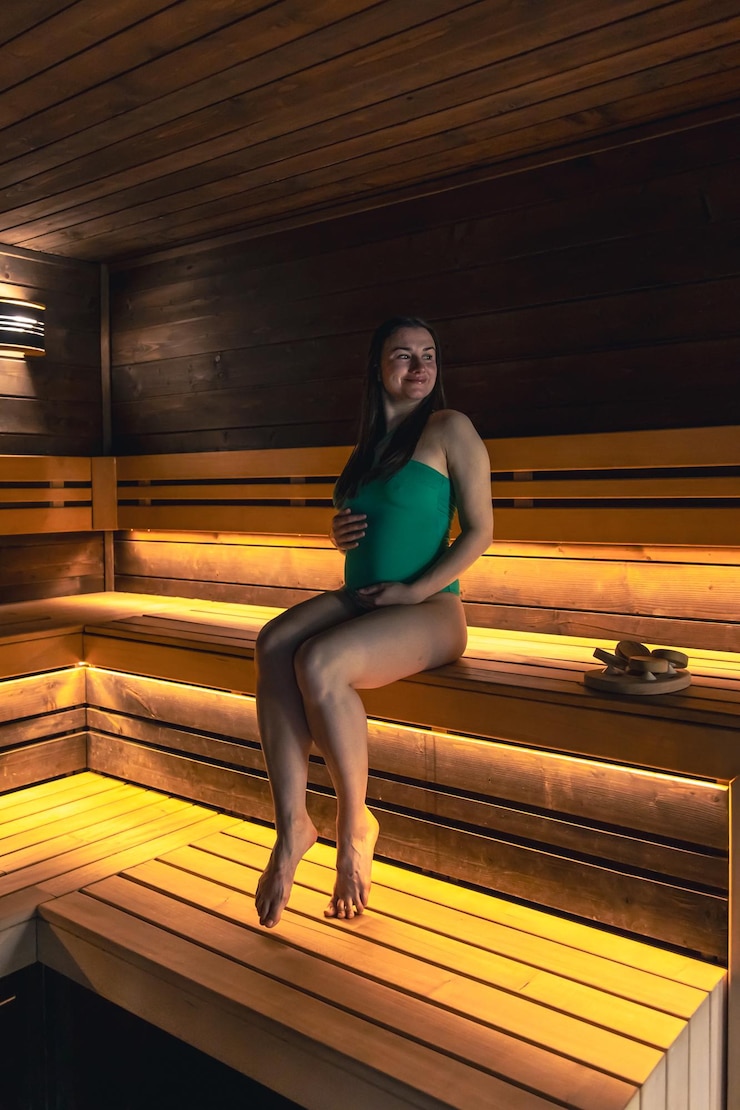 Free Photo a young woman having rest in sauna alone