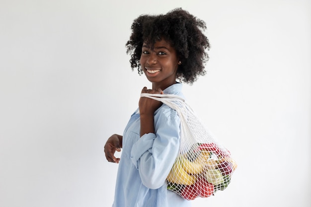 Free photo young woman having a sustainable lifestyle indoors