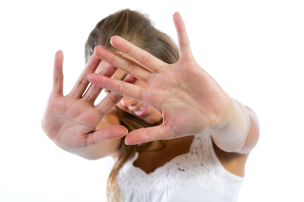 young woman hiding from the camera