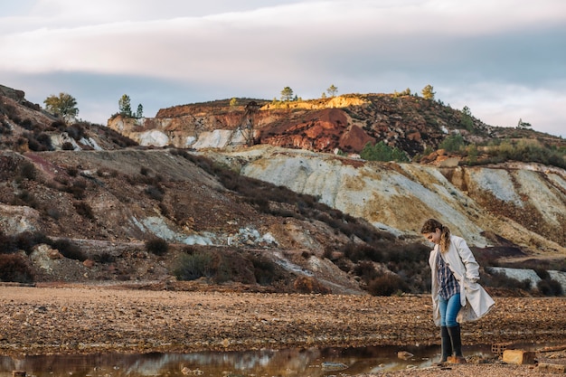 Free photo young woman in hillside