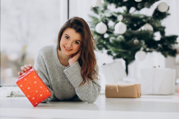 Young woman holding christmas presents