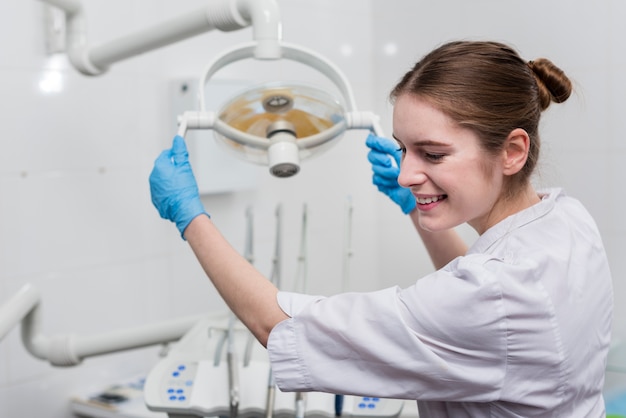 Young woman holding dental equipment